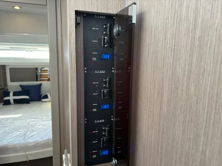  Yacht Photos Pics Electrical panel inside 2025 Jeanneau 1295 FLY yacht cabin, showcasing modern controls.