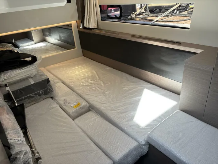  Yacht Photos Pics Interior cabin of 2025 Jeanneau 1295 FLY yacht with modern furnishings.