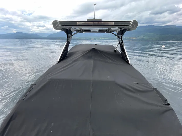  Yacht Photos Pics 2020 Cobalt A29 boat with cover on a calm lake.