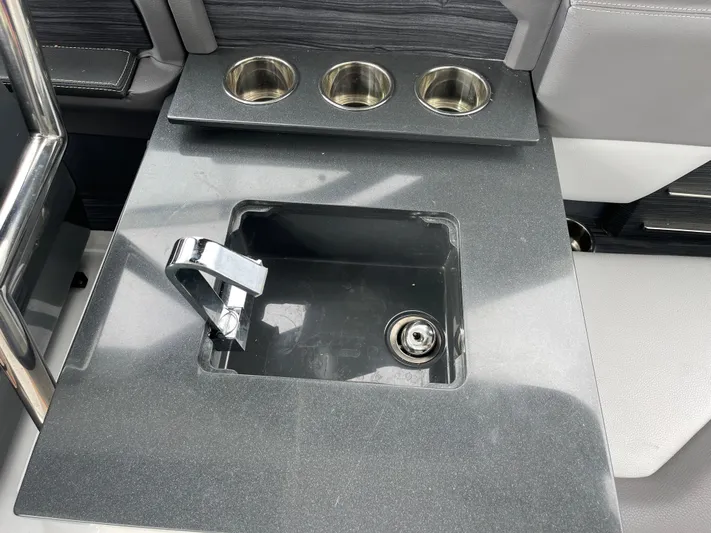  Yacht Photos Pics Cobalt A29 2020 boat sink with faucet and cup holders on deck.