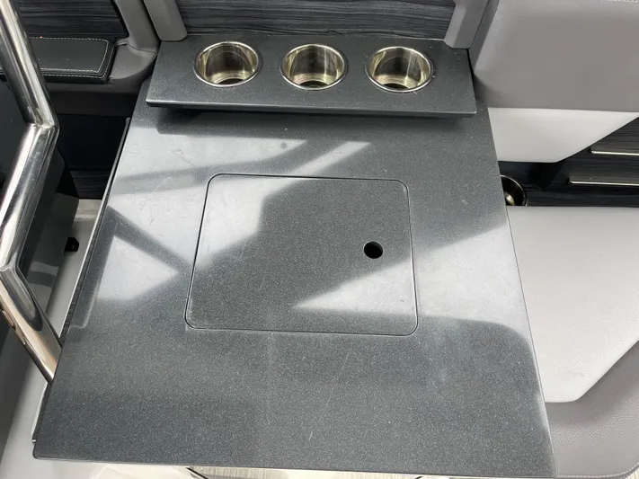  Yacht Photos Pics 2020 Cobalt A29 boat interior with cup holders and sleek countertop design.