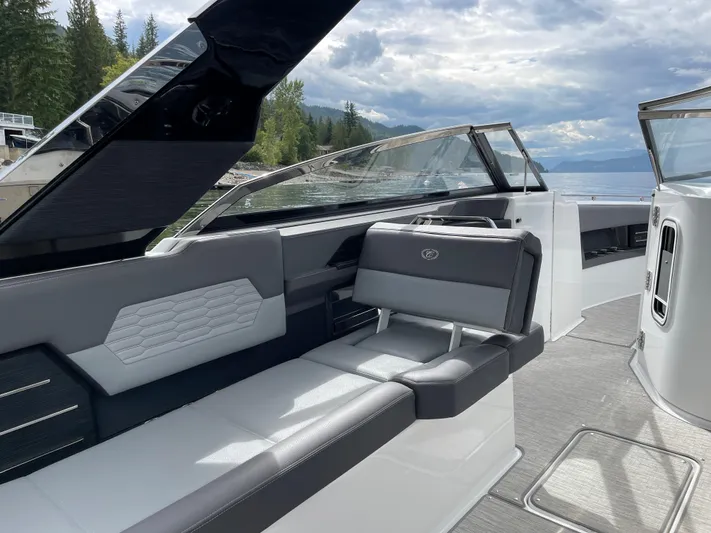  Yacht Photos Pics 2020 Cobalt A29 boat interior with sleek seating and scenic lake view.