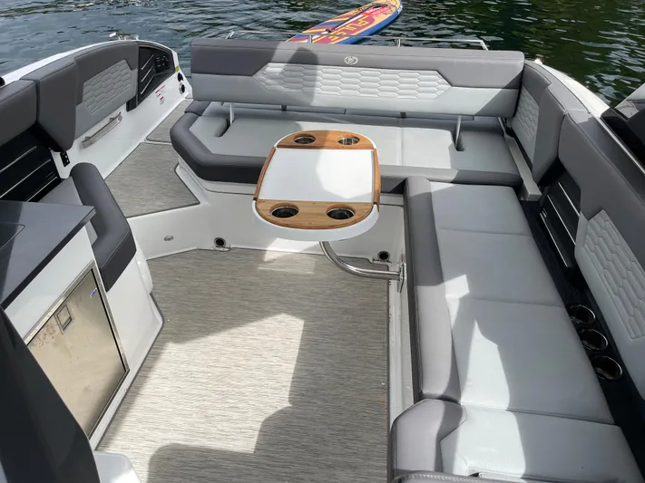  Yacht Photos Pics 2020 Cobalt A29 boat interior with seating and table on the water.