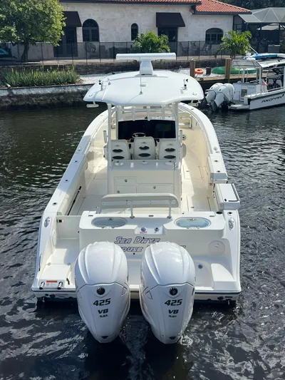  Yacht Photos Pics 2020 Cobia 350 boat with twin 425 V8 engines docked in a marina.