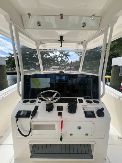  Yacht Photos Pics 2020 Cobia 350 boat helm with advanced navigation system and steering wheel.