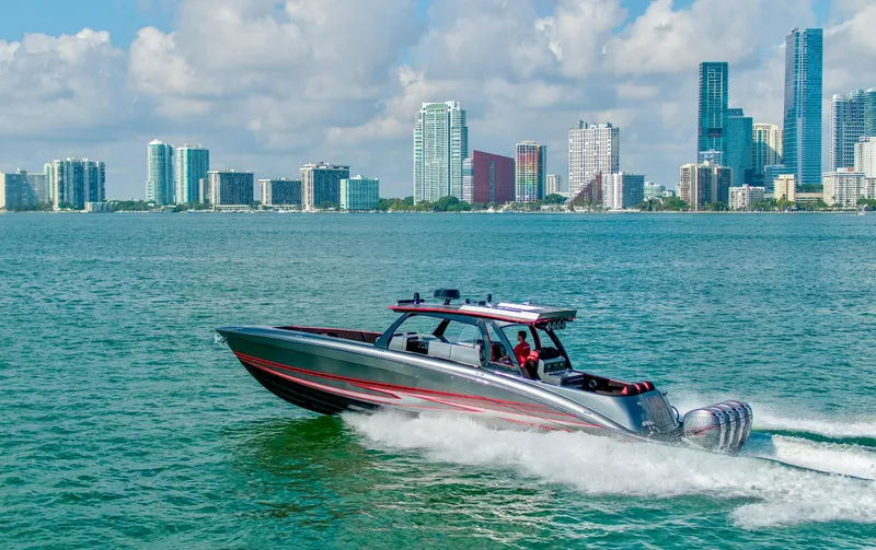  Yacht Photos Pics Sleek 2021 Concept 44' Open Deck boat cruising near city skyline.