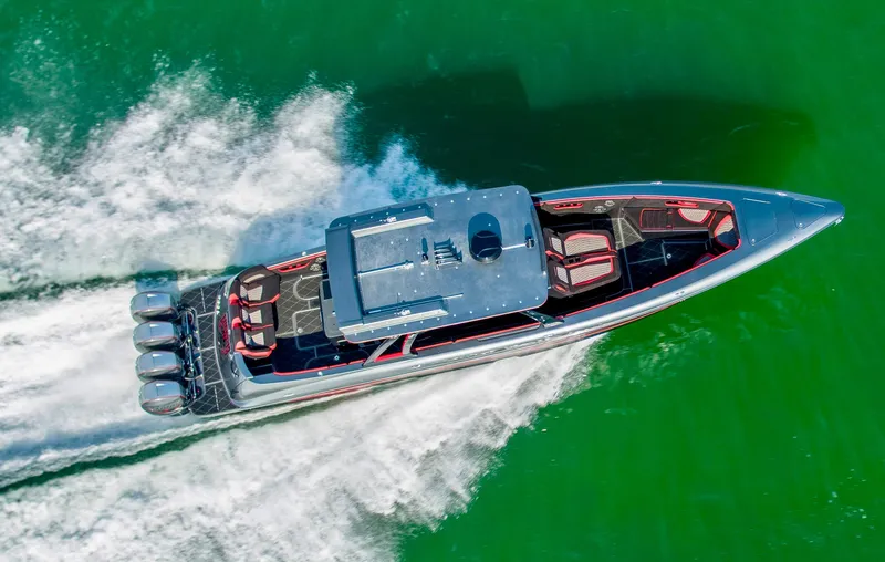  Yacht Photos Pics Aerial view of 2021 Concept 44' Open Deck boat speeding on green water.