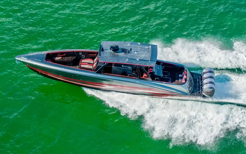  Yacht Photos Pics Sleek 2021 Concept 44' Open Deck boat cruising on vibrant green water.