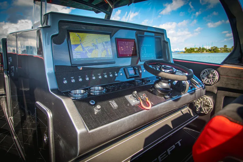  Yacht Photos Pics 2021 Concept 44' Open Deck boat dashboard with navigation screens and steering wheel.