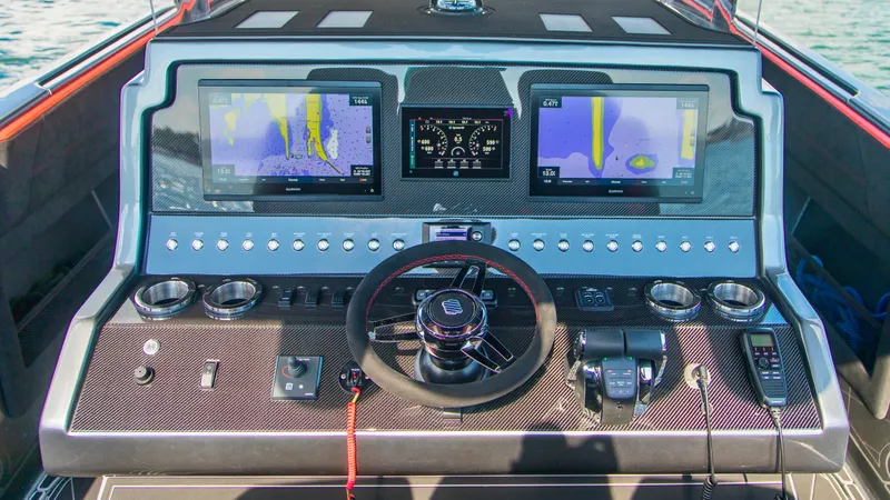  Yacht Photos Pics Control panel of 2021 Concept 44' Open Deck boat with advanced navigation displays.