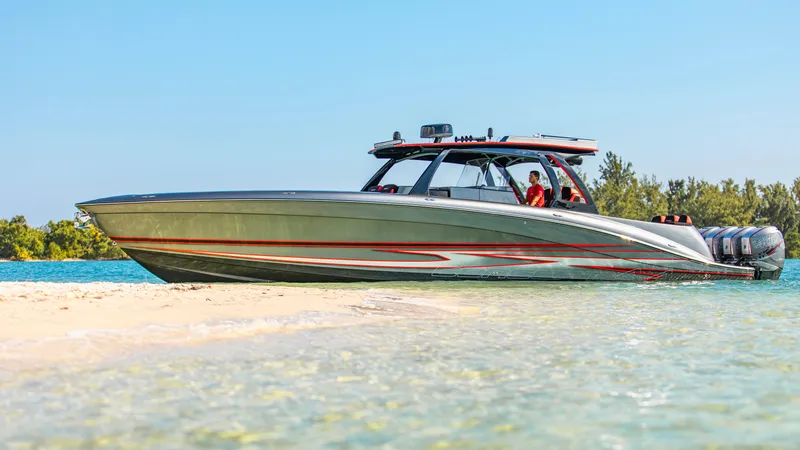  Yacht Photos Pics 2021 Concept 44' Open Deck boat on sandy beach with clear blue water.