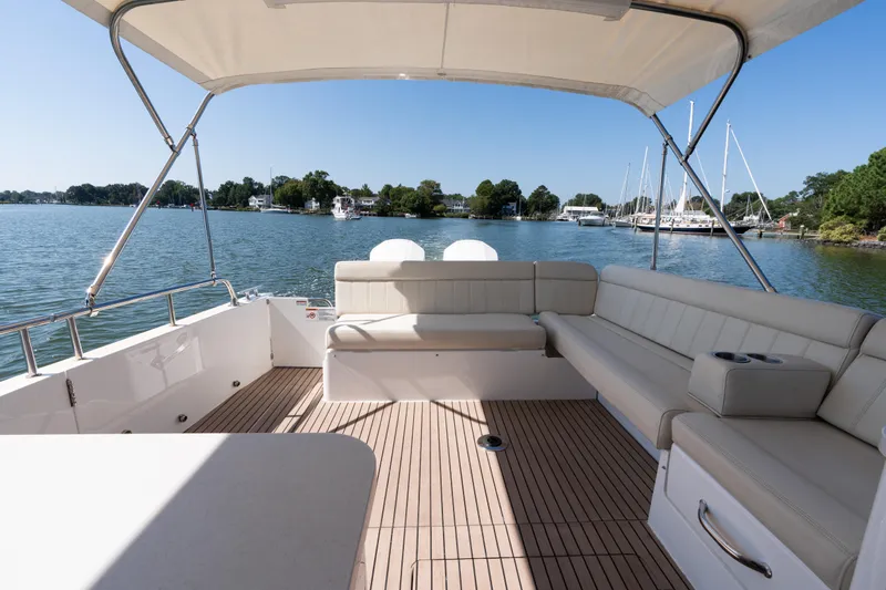 Middle Path Yacht Photos Pics 2023 MJM 4 boat interior with spacious seating and scenic waterfront view.