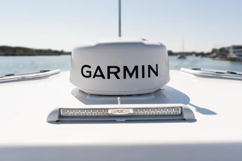 Middle Path Yacht Photos Pics Garmin radar on 2023 MJM Yachts 4, with water and boats in background.