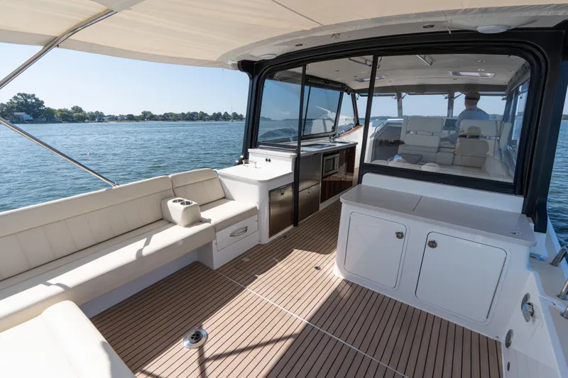 Middle Path Yacht Photos Pics 2023 MJM Yachts 4 model, featuring spacious deck and seating, cruising on calm waters.