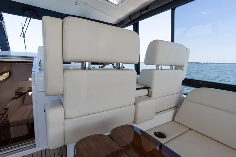 Middle Path Yacht Photos Pics Luxurious interior of 2023 MJM Yachts 4 with plush seating and ocean view.