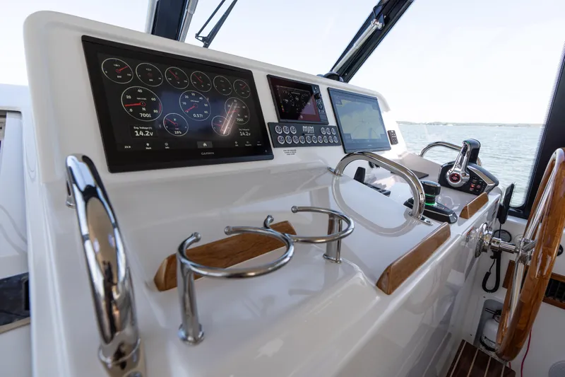 Middle Path Yacht Photos Pics Helm of 2023 MJM Yachts 4 with advanced navigation displays and controls.