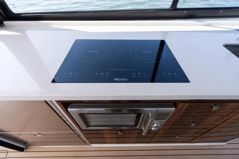 Middle Path Yacht Photos Pics Modern kitchen in 2023 MJM Yachts 4 with induction cooktop and microwave.