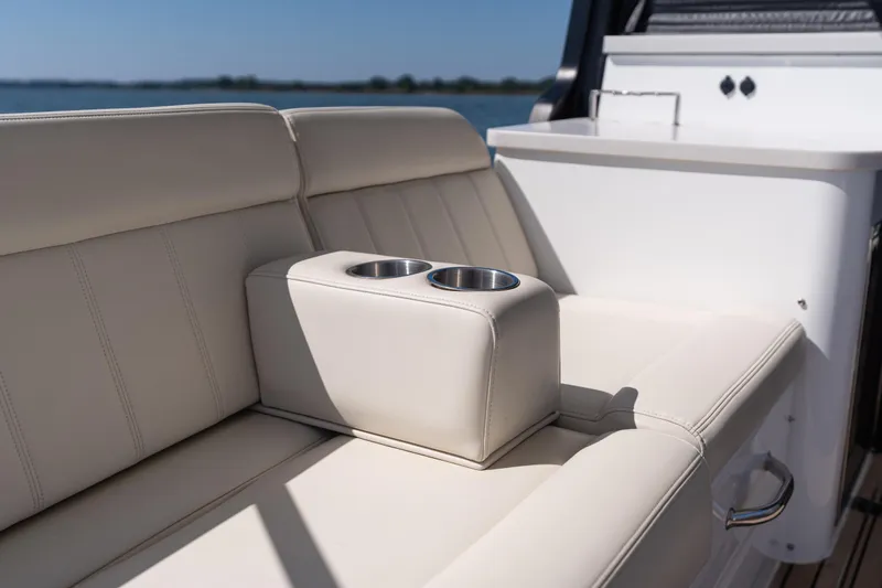 Middle Path Yacht Photos Pics Luxurious seating on 2023 MJM Yachts 4 with built-in cup holders, ocean view.