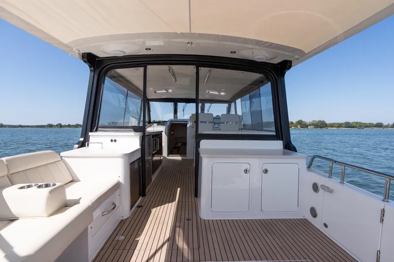 Middle Path Yacht Photos Pics 2023 MJM Yachts 4 interior with sleek design and spacious deck on calm waters.