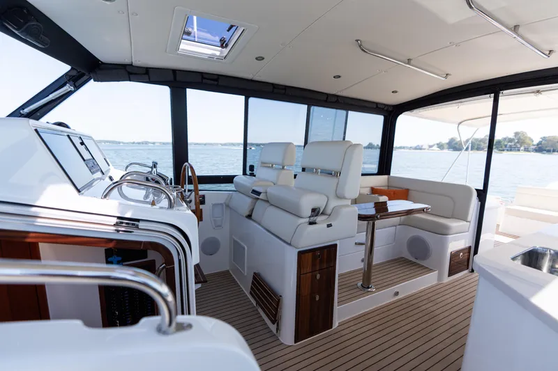 Middle Path Yacht Photos Pics Luxurious interior of 2023 MJM Yachts 4, featuring elegant seating and modern design.