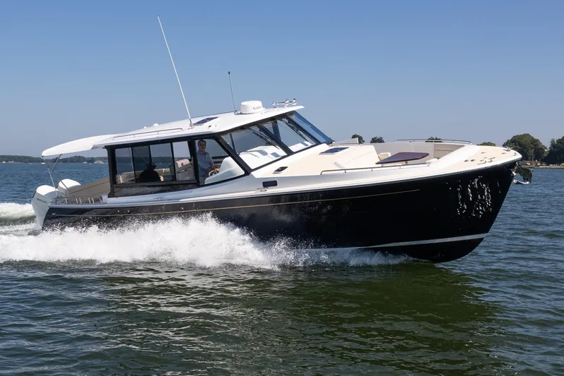 Middle Path Yacht Photos Pics 2023 MJM Yachts 4 cruising on open water, showcasing sleek design and performance.