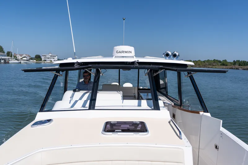 Middle Path Yacht Photos Pics 2023 MJM Yachts 4 cruising on calm waters under clear blue skies.