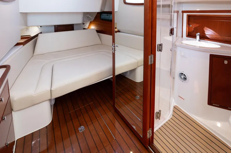 Middle Path Yacht Photos Pics Luxurious interior of 2023 MJM Yachts 4, featuring elegant wood finishes and comfortable seating.