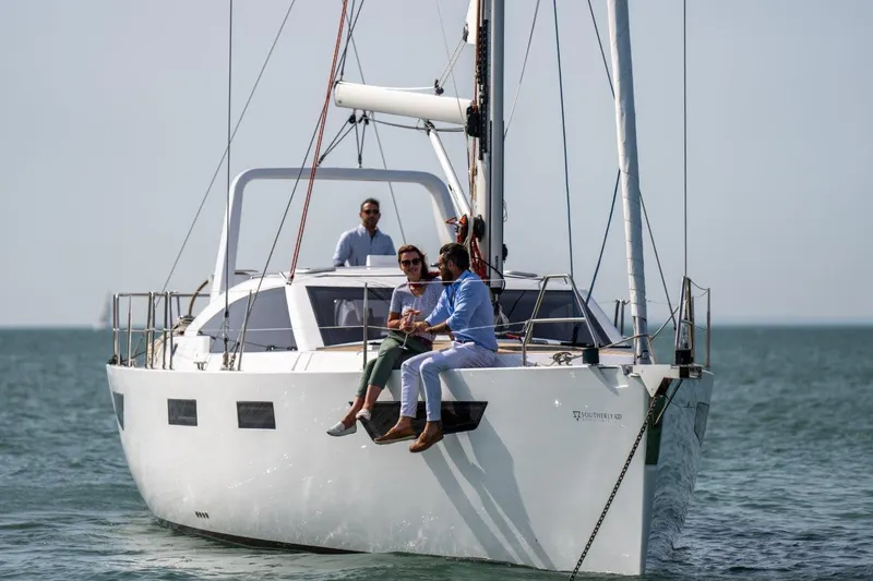 Off The Grid Yacht Photos Pics 2024 Southerly 420 yacht sailing with passengers on a sunny day.