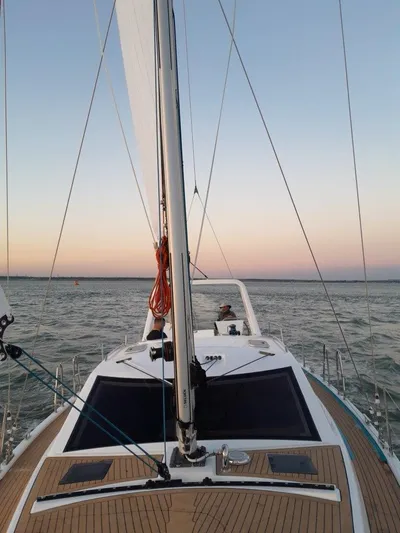 Off The Grid Yacht Photos Pics 2024 Southerly 420 sailboat on open water at sunset.