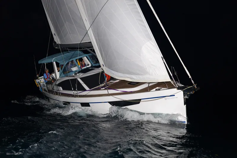 Off The Grid Yacht Photos Pics 2024 Southerly 420 sailboat navigating at night with full sails.