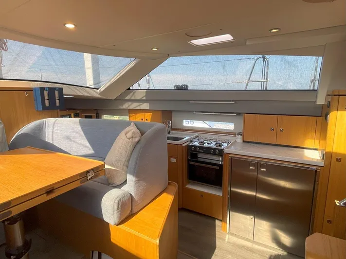 Off The Grid Yacht Photos Pics Interior of 2024 Southerly 420 yacht with modern kitchen and seating area.