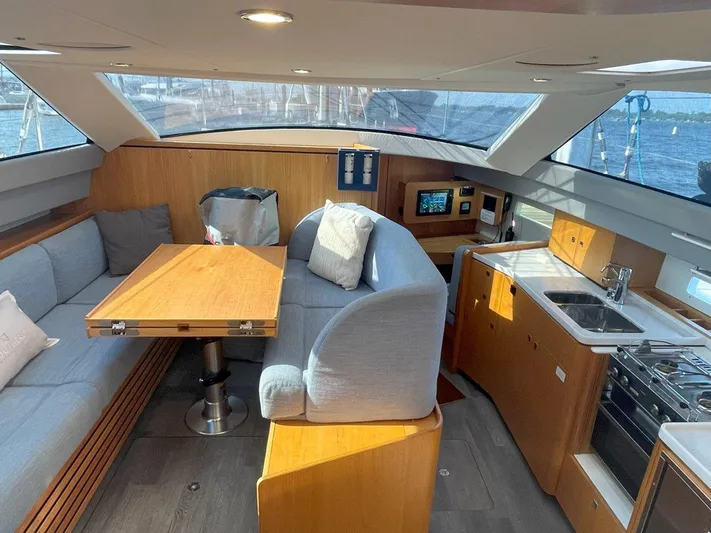 Off The Grid Yacht Photos Pics 2024 Southerly 420 yacht interior with dining area and kitchen.