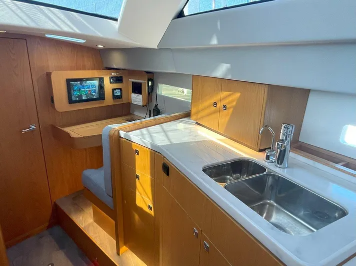 Off The Grid Yacht Photos Pics Modern interior of 2024 Southerly 420 yacht with sleek kitchen and navigation area.