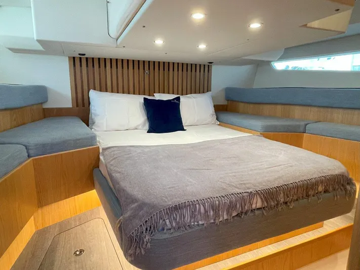 Off The Grid Yacht Photos Pics Luxurious cabin interior of 2024 Southerly 420 yacht with cozy bedding and ambient lighting.