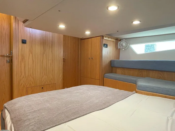 Off The Grid Yacht Photos Pics Interior of 2024 Southerly 420 yacht, featuring cozy wooden cabin and comfortable seating.