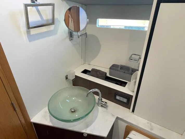 Off The Grid Yacht Photos Pics Modern bathroom in 2024 Southerly 420 yacht with glass sink and mirror.