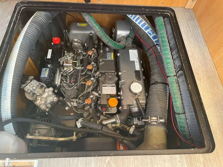 Off The Grid Yacht Photos Pics Engine compartment of a 2024 Southerly 420 yacht, showcasing mechanical components and hoses.