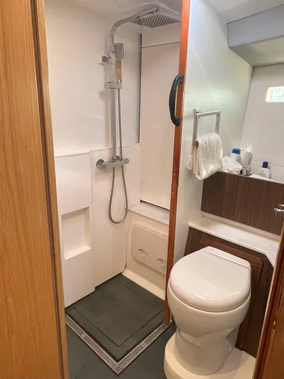 Off The Grid Yacht Photos Pics Modern bathroom in 2024 Southerly 420 yacht with shower and toilet.