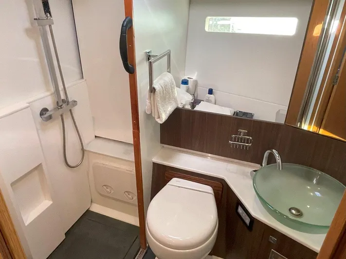 Off The Grid Yacht Photos Pics Modern bathroom in 2024 Southerly 420 yacht with glass sink and shower.