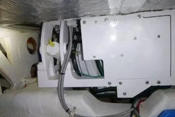 Salty Sam Yacht Photos Pics Engine compartment of a 2014 Tiara 5000 Coupe, showcasing mechanical components and wiring.