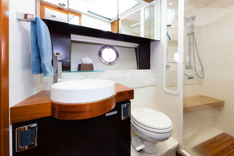 Salty Sam Yacht Photos Pics Luxurious bathroom in 2014 Tiara 5000 Coupe yacht with modern fixtures and shower.