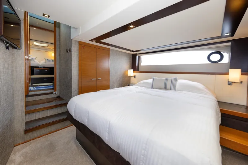 Salty Sam Yacht Photos Pics Luxurious bedroom interior of 2014 Tiara 5000 Coupe yacht with modern design.