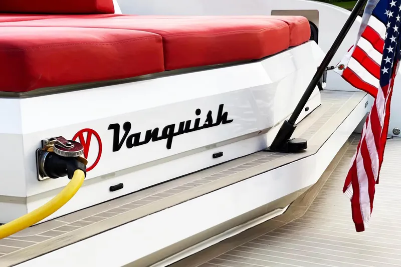  Yacht Photos Pics 2016 Vanquish Yachts 48 with red seating and American flag on deck.