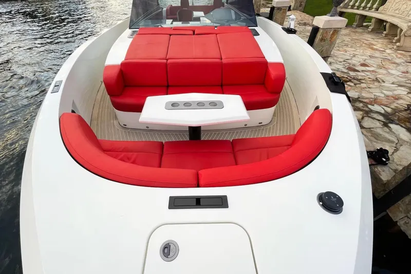  Yacht Photos Pics 2016 Vanquish Yachts 48 with red seating and sleek design on the water.