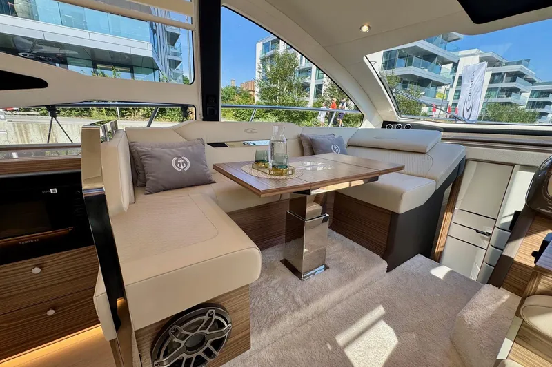  Yacht Photos Pics Luxurious interior of 2025 Cobrey 42 FLY yacht with elegant seating and modern design.