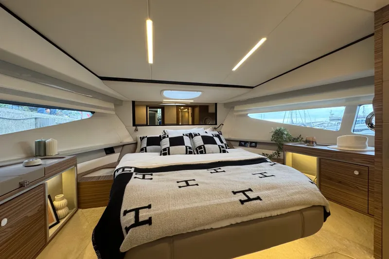  Yacht Photos Pics Luxurious bedroom interior of 2025 Cobrey 42 FLY yacht with modern design and elegant decor.