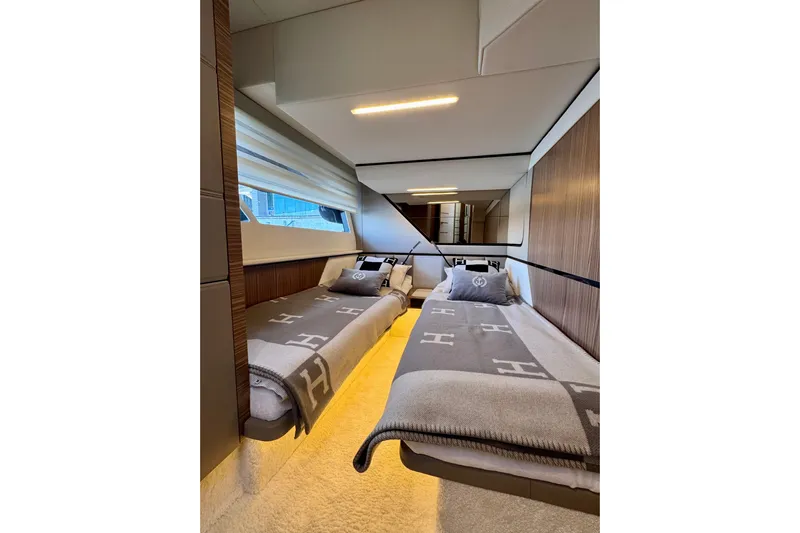  Yacht Photos Pics Luxurious twin cabin interior of 2025 Cobrey 42 FLY yacht, featuring modern design and cozy bedding.