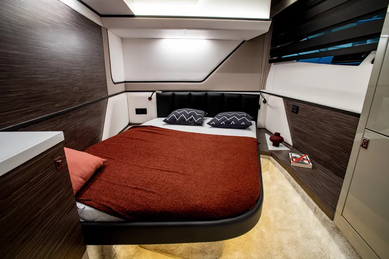  Yacht Photos Pics Luxurious bedroom interior of 2025 Cobrey 42 FLY yacht with modern design elements.