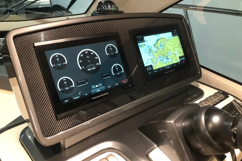  Yacht Photos Pics Dashboard of 2025 Cobrey 42 FLY yacht with navigation and control screens.
