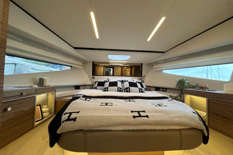  Yacht Photos Pics Luxurious interior of 2025 Cobrey 42 FLY yacht with elegant bedroom design.